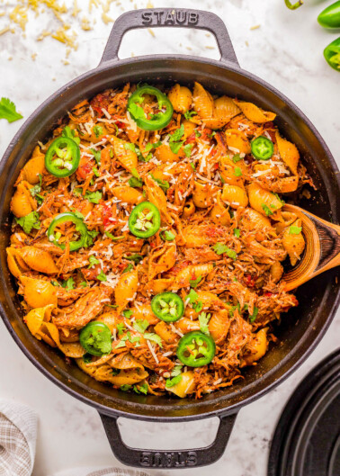 Chicken Chorizo Pasta - Tender pasta shells are mixed with chorizo and seasoned shredded chicken in a cream cheese and tomato based sauce for a truly FLAVORFUL comfort food dinner recipe! Ready in 45 minutes, EASY, and with just the right amount of heat to have everyone asking for seconds! 