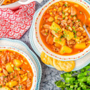 Cowboy Stew - All the cowboys, cowgirls, and meat lovers are going to LOVE this EASY stew recipe with ground beef, bacon, and sausage! There are also beans, potatoes, and corn simmered in a flavorful chili powder, smoked paprika, and cumin broth. Ready in 45 minutes, this is pure hearty comfort food that the whole family will enjoy! 