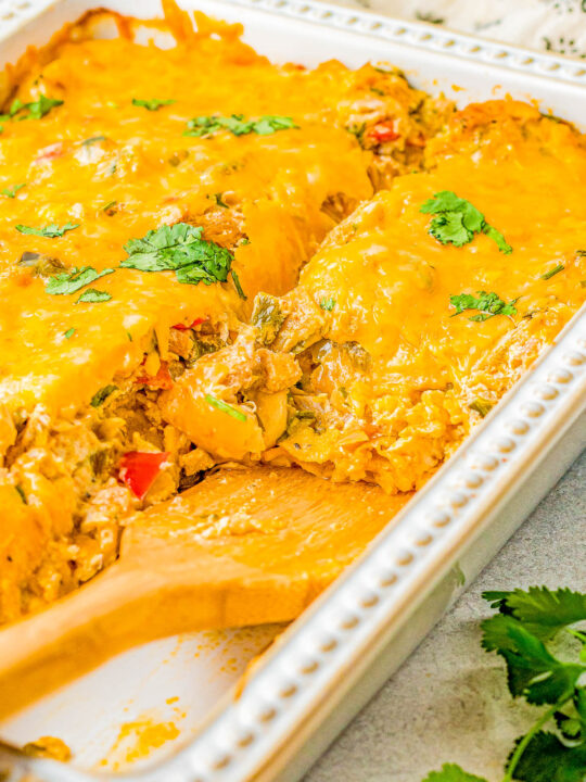 King Ranch Chicken - Nothing says comfort food like an EASY casserole recipe with shredded chicken, cheese, salsa, sour cream, layered with tortillas, and seasoned to perfection! Use rotisserie chicken to save time making this a great family-friendly weeknight dinner recipe!