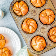 Cinnamon Sugar Pretzel Twists - Baked in a muffin pan and made with refrigerated dough to save time, you're going to LOVE how FAST and EASY these finger-lickin' sweet pretzel bites are! A simple powdered sugar glaze makes pulling apart this buttery soft pretzel dough coated with cinnamon and sugar just irresistible! 