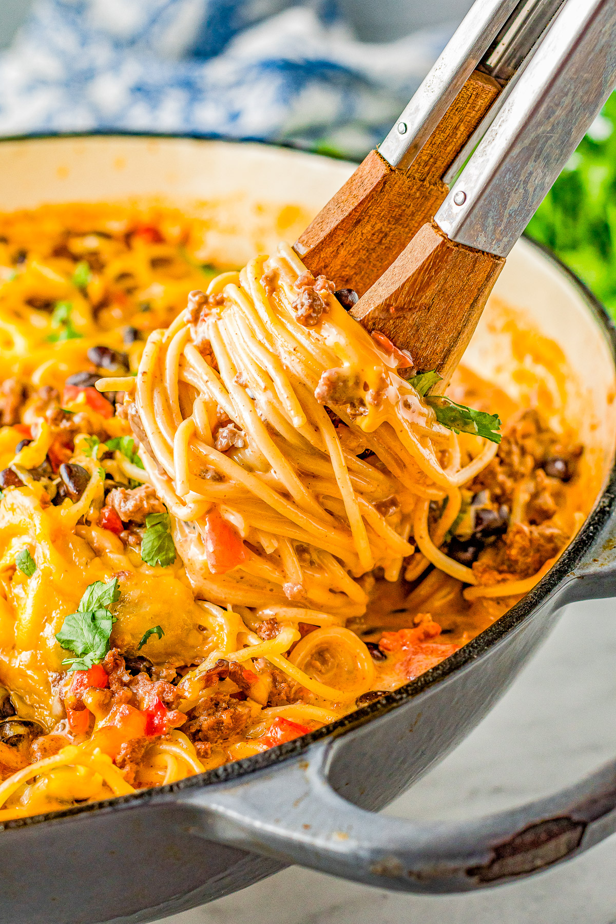 Taco Spaghetti - Tender spaghetti noodles are tossed in a creamy cheese sauce along with seasoned ground beef, tomatoes, green chiles, black beans, and cilantro! The PERFECT family-friendly weeknight dinner recipe that's super EASY and ready in 30 minutes!