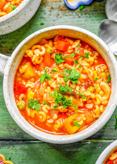 30-Minute Homemade Alphabet Soup - Tender alphabet pasta in a tomato flavored broth with a variety of vegetables including carrots, corn, peas, and green beans. So much BETTER than the canned store bought alternatives that many of us grew up with! A one pot EASY recipe that's perfect for busy weeknights!
