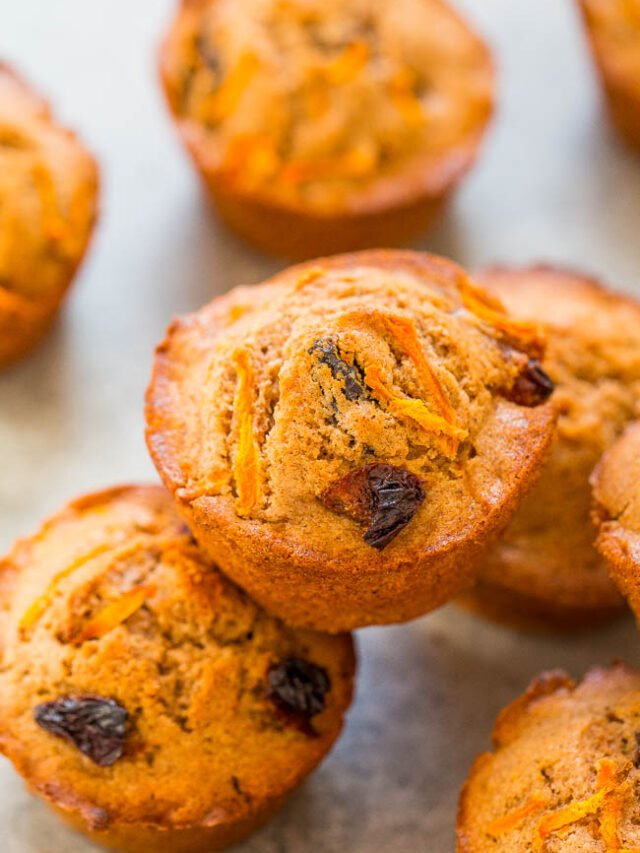 Freshly baked carrot cake muffins on a baking tray.