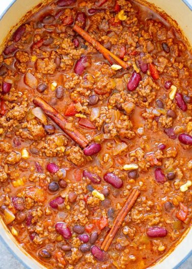 A pot of chunky chili with beans, ground meat, and spices.