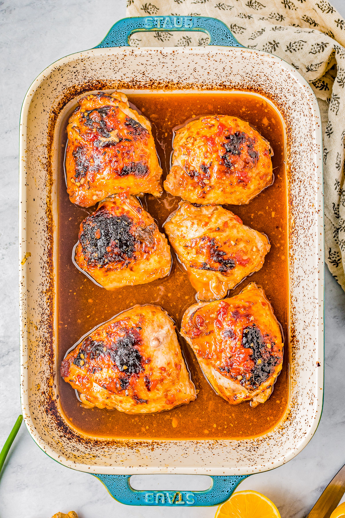 Honey Soy Baked Chicken Thighs - The chicken marinates in the most delectable mixture of soy sauce, honey, garlic, ginger, and more. The resulting baked chicken is SO tender, juicy, moist, and loaded with Asian-inspired flavors! Even better, this is a one-pan, EASY recipe the whole family will adore! 