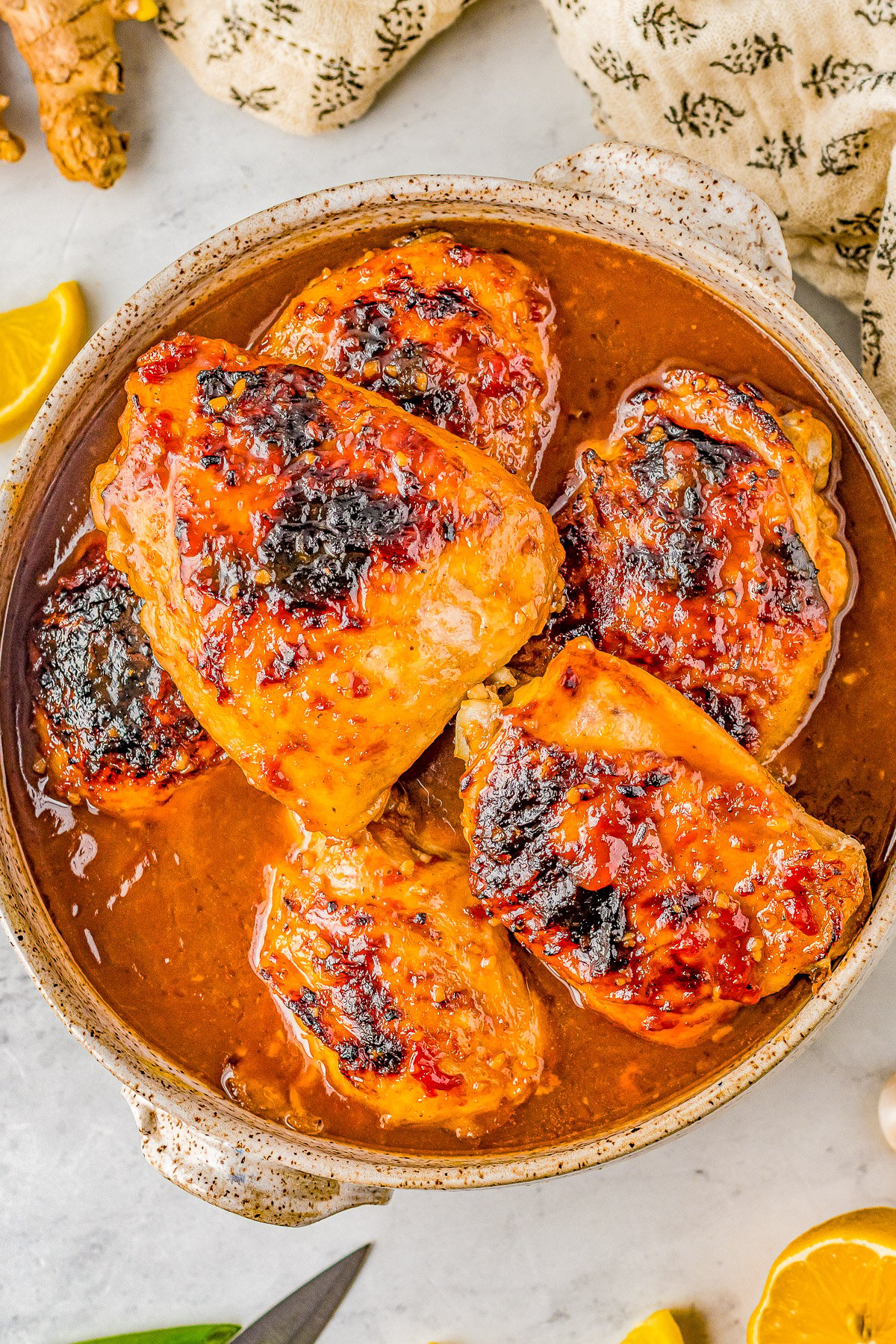 Honey Soy Baked Chicken Thighs - The chicken marinates in the most delectable mixture of soy sauce, honey, garlic, ginger, and more. The resulting baked chicken is SO tender, juicy, moist, and loaded with Asian-inspired flavors! Even better, this is a one-pan, EASY recipe the whole family will adore! 