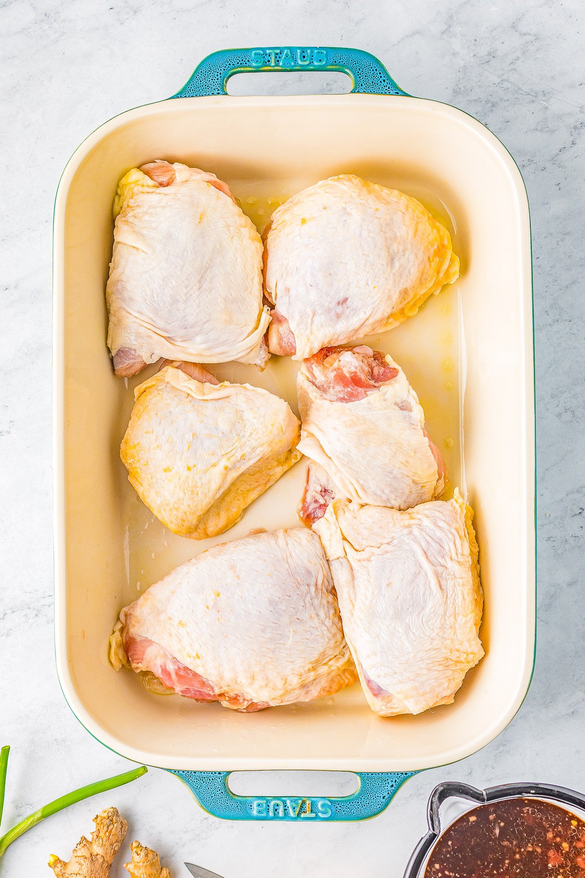 Honey Soy Baked Chicken Thighs - The chicken marinates in the most delectable mixture of soy sauce, honey, garlic, ginger, and more. The resulting baked chicken is SO tender, juicy, moist, and loaded with Asian-inspired flavors! Even better, this is a one-pan, EASY recipe the whole family will adore!