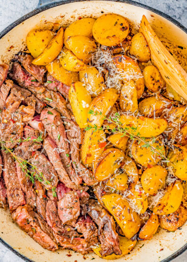 Steak and Potatoes Skillet - Made with garlic butter, herbs and spices, these juicy steak bites just melt in your mouth! Plus there are buttery and tender potatoes with lightly crisped edges. Made in just ONE skillet and ready quickly, my EASY recipe walks you through how to make the PERFECT steak and potatoes meal!