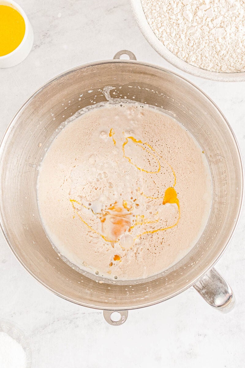 Wet ingredients for Texas Roadhouse rolls being combined in a bowl.