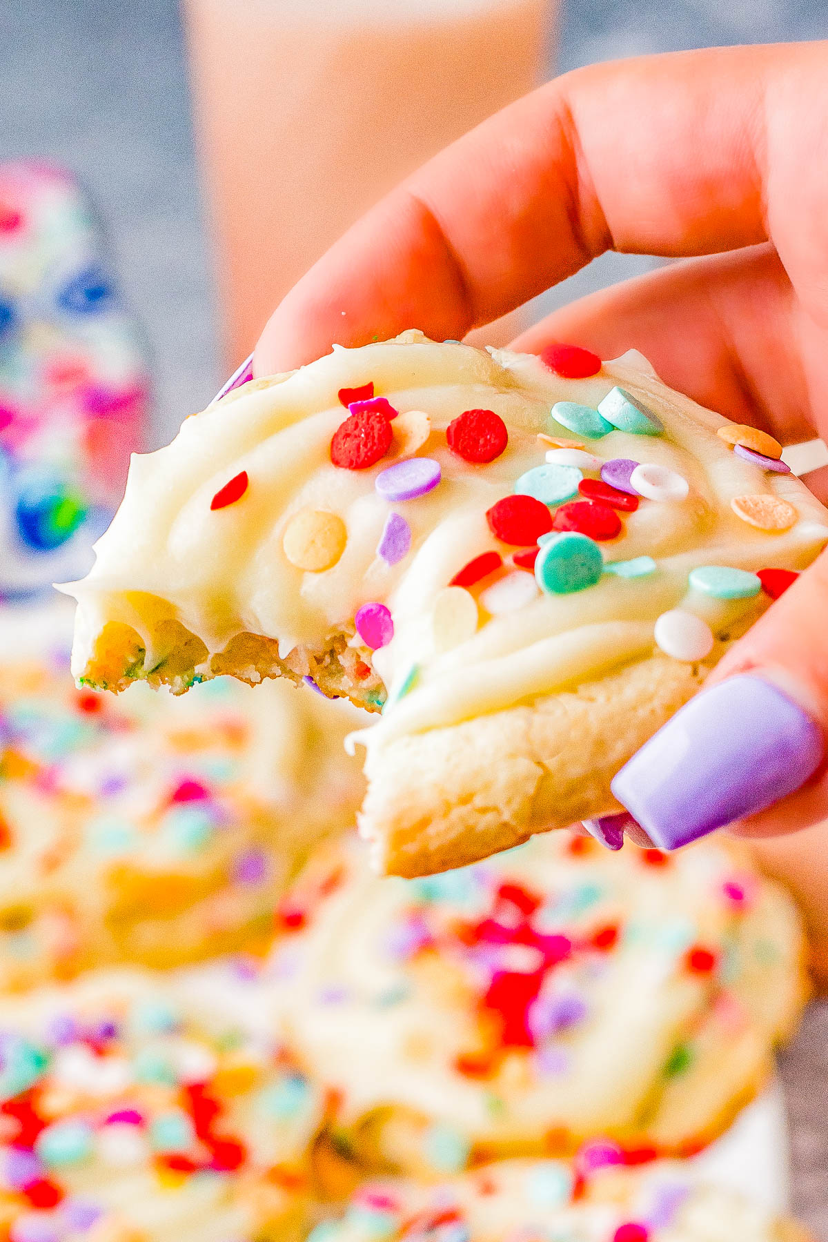 Confetti Cake Cookies (Crumbl Cookie Copycat Recipe) - Jumbo, super soft, slightly chewy cake mix cookies that are a PERFECT COPYCAT of the famous Crumbl Cookies! Loaded with rainbow and confetti sprinkles, and topped with vanilla cream cheese frosting, these are a dead ringer for the real thing! 