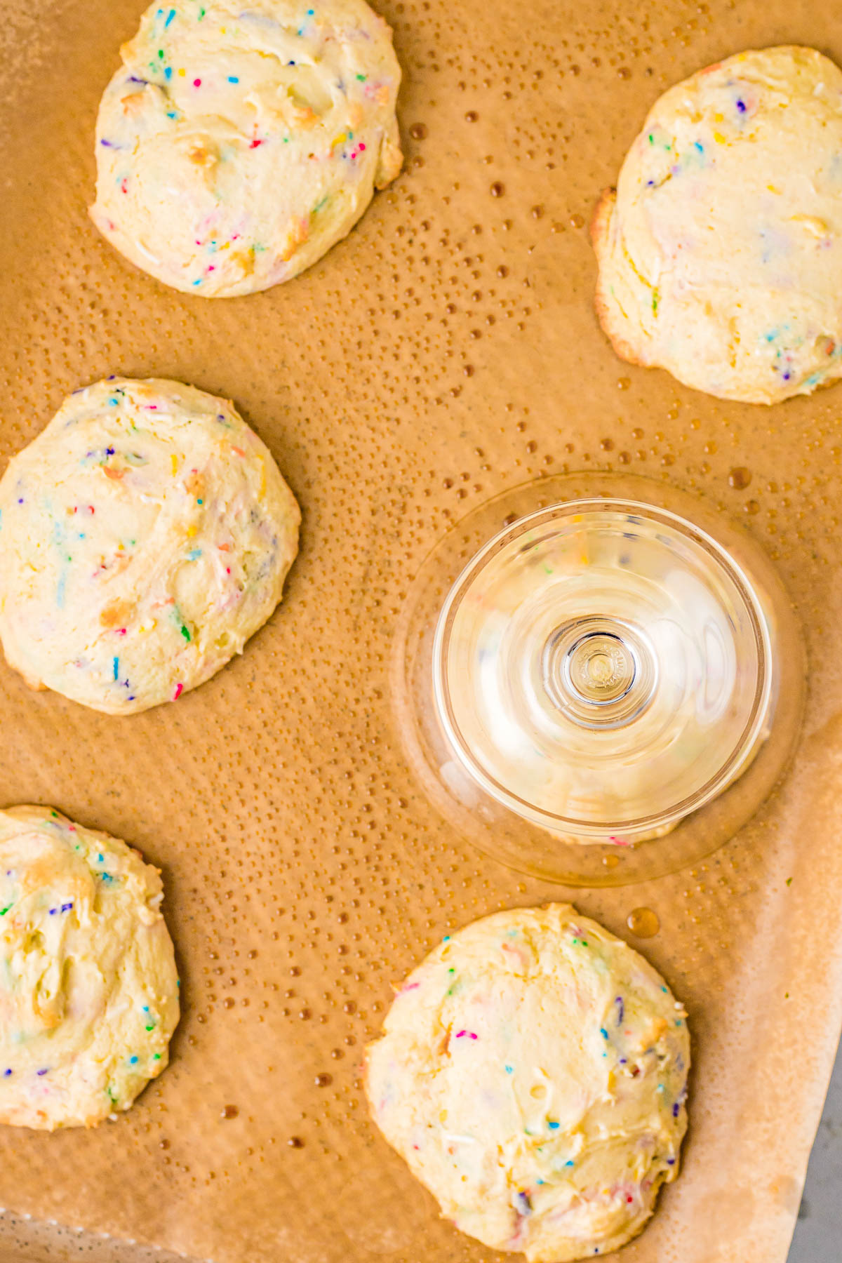 Confetti Cake Cookies (Crumbl Cookie Copycat Recipe) - Jumbo, super soft, slightly chewy cake mix cookies that are a PERFECT COPYCAT of the famous Crumbl Cookies! Loaded with rainbow and confetti sprinkles, and topped with vanilla cream cheese frosting, these are a dead ringer for the real thing!