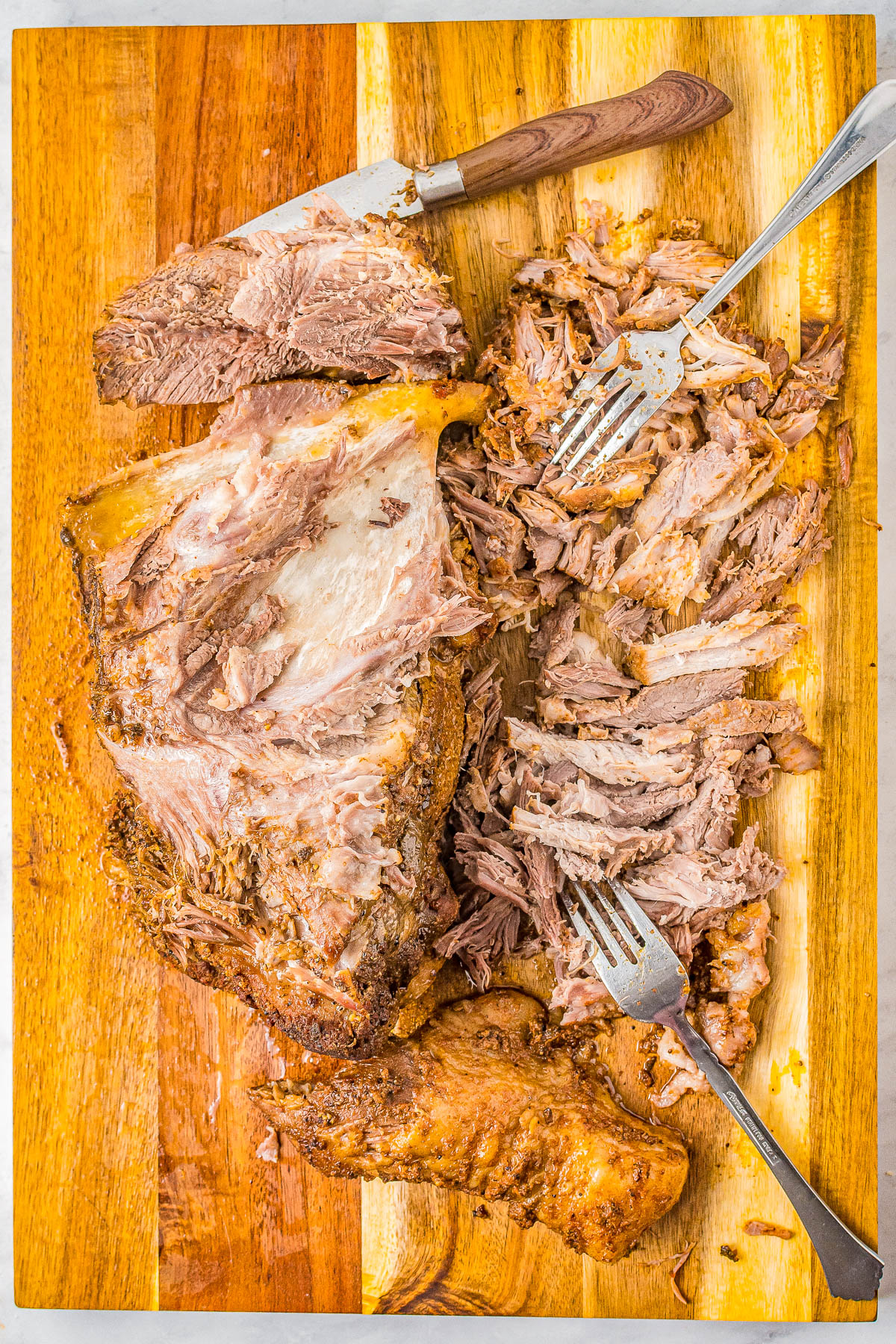 Slow Cooker Pulled Pork - The EASIEST recipe for pulled pork because your Crock-Pot does all the work for you! Set it and forget it for this AMAZING pulled pork that's super flavorful and so tender and juicy! Great for pulled pork sandwiches and tacos!
