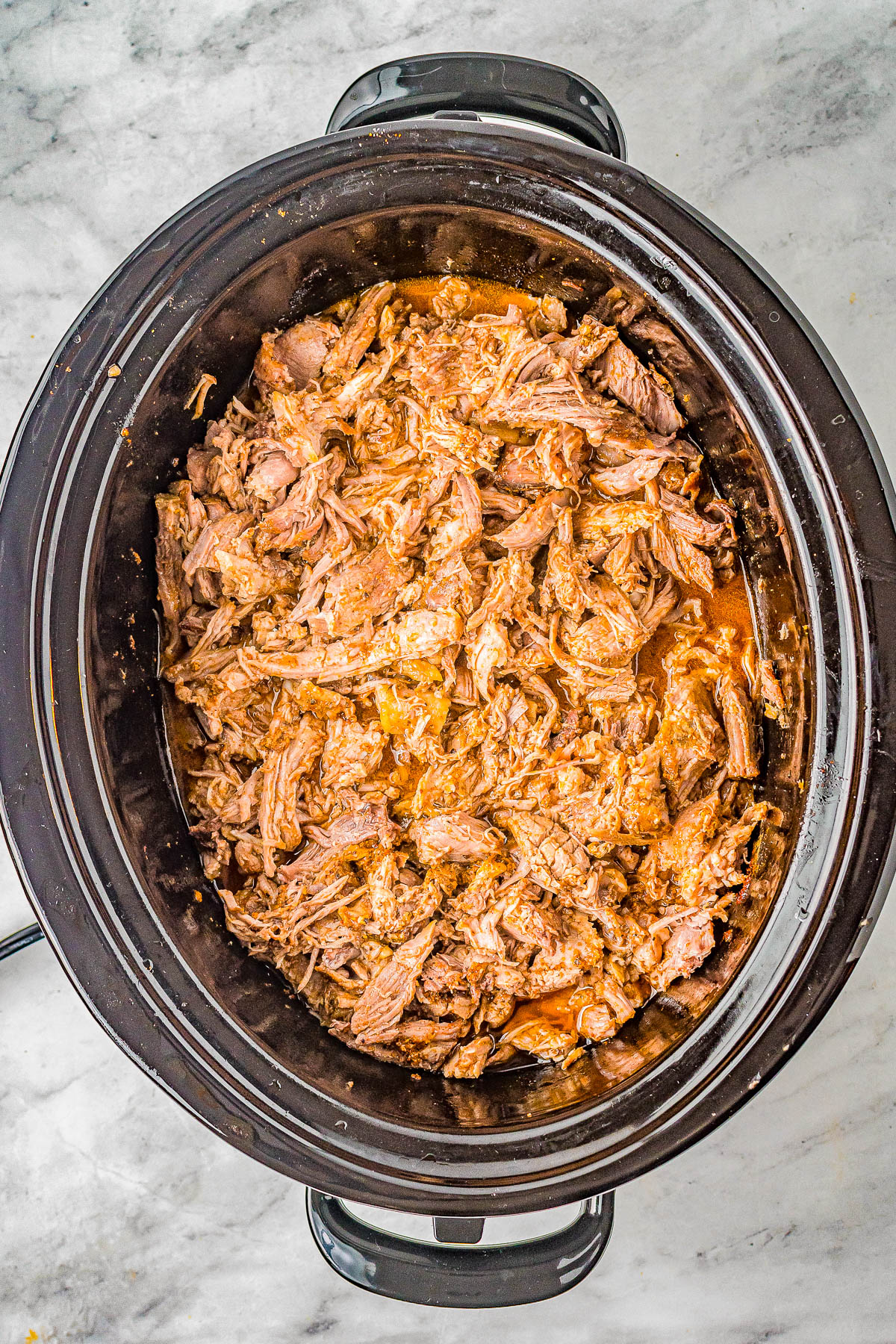Slow Cooker Pulled Pork - The EASIEST recipe for pulled pork because your Crock-Pot does all the work for you! Set it and forget it for this AMAZING pulled pork that's super flavorful and so tender and juicy! Great for pulled pork sandwiches and tacos!