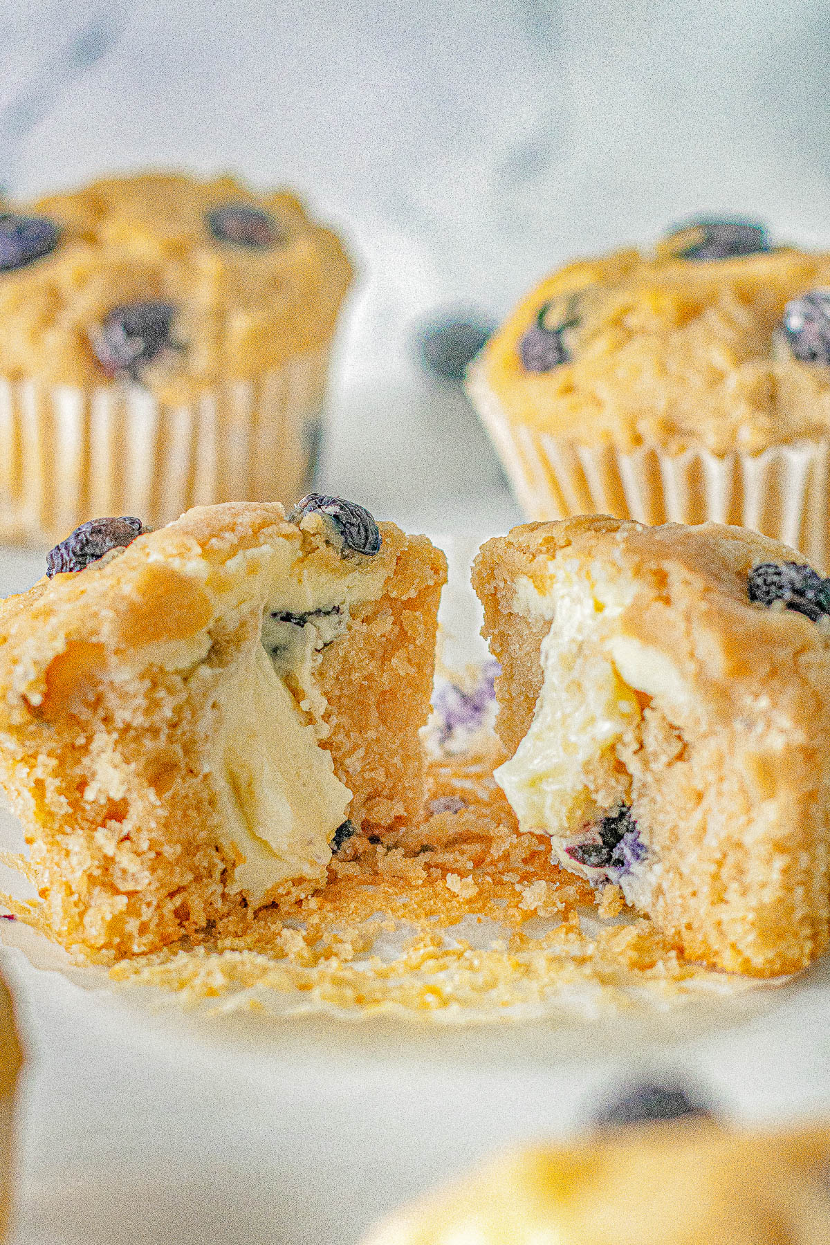 Blueberry Cream Cheese Muffins – These FAST and EASY blueberry muffins are chock full of juicy blueberries and they’re filled with tangy-sweet cream cheese! You’re going to fall in LOVE with their super soft and moist texture! Perfect for breakfast, brunch, snacks, or dessert! No mixer required and you can use fresh or frozen berries.