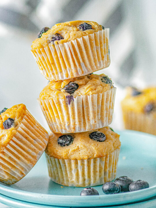 Blueberry Cream Cheese Muffins - These FAST and EASY blueberry muffins are chock full of juicy blueberries and they're filled with tangy-sweet cream cheese! You're going to fall in LOVE with their super soft and moist texture! Perfect for breakfast, brunch, snacks, or dessert! No mixer required and you can use fresh or frozen berries.