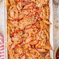 Slow Cooker Cherry Cola Pulled Pork - Super juicy, smoky, tangy-and-sweet pulled pork that is just bursting with flavor and moisture thanks to Cherry Coke and barbecue sauce! The EASIEST recipe because your Crock-Pot does all the work! Perfect for Memorial Day, Father's Day, barbecues, potlucks, game day events, and more.