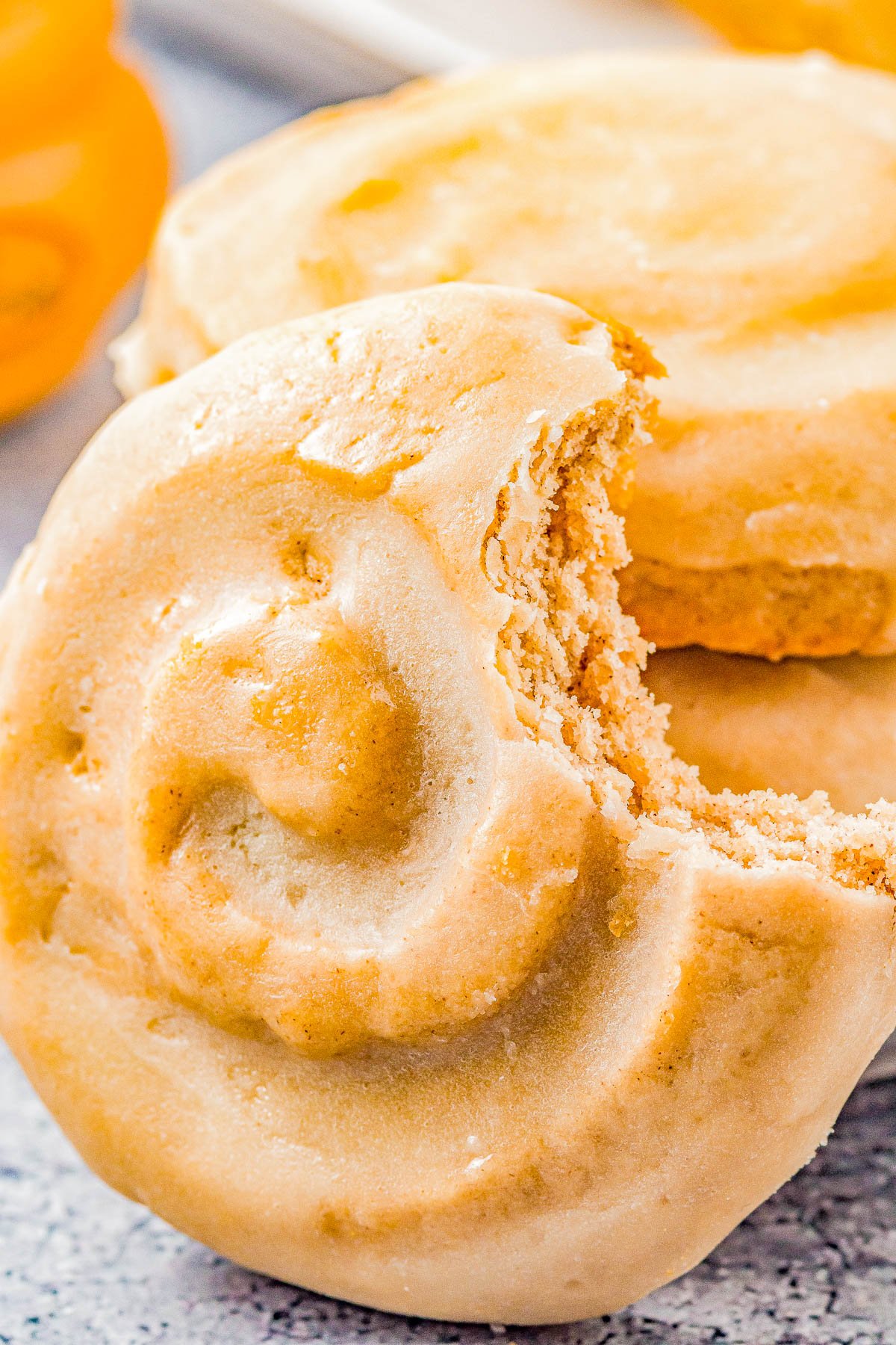 Honey Bun Cookies (Crumbl Cookies Copycat) - Soft and chewy with a warm buttery cinnamon flavor, these cookies resemble a classic Honey Bun with their fun swirl on top! The sweet honey glaze makes them IRRESISTIBLE! This EASY Crumbl Cookies copycat recipe will become a family FAVORITE! 