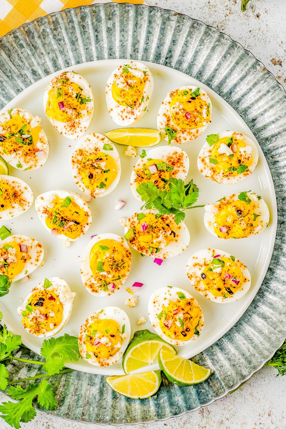 Mexican Street Corn Deviled Eggs - Deviled eggs get a south-of-the-border makeover by incorporating grilled Mexican street corn, jalapeno, red onion, cilantro, lime juice, queso fresco, and chili powder! This is an EASY appetizer or picnic recipe that everyone adores! Serve these at your next summer event including Memorial Day, Father's Day, Fourth of July, or make them for game day parties! 