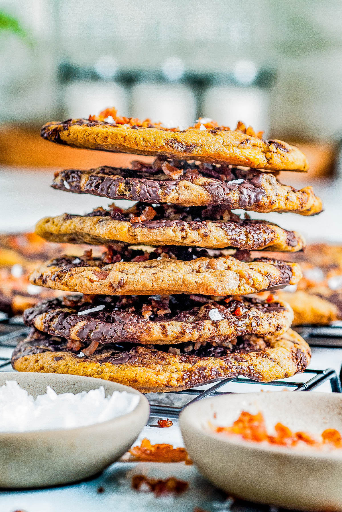 Bacon Chocolate Chip Cookies - These decadent and indulgent chocolate chip cookies are the perfect balance of savory, salty and sweet in every delectable chewy bite! With crispy bacon, butterscotch chips, tons of melted chocolate, and flaky sea salt, they're a flavor explosion for those bold enough to give them a try! 