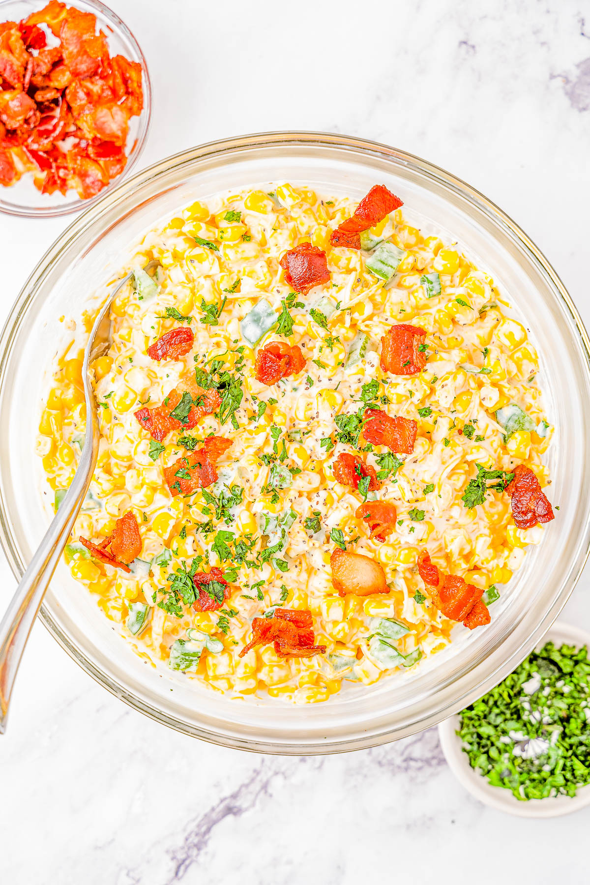 Creamy Corn and Bacon Salad - This EASY creamy corn salad with crispy bacon, jalapeño peppers and green onions for extra flavor, and plenty of shredded cheese will be a few FAVORITE side dish! Perfect for your next picnic, potluck, barbecue, or summer holiday like the 4th of July or Labor Day and it's ready in 15 minutes! 