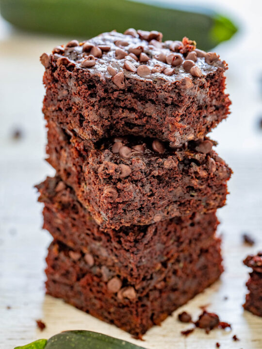 Zucchini Brownies - The BEST zucchini brownies that are EASY, made in one bowl, and no mixer required! Soft, fudgy, and almost taste like rich chocolate cake. They're filled and topped with mini chocolate chips to add even more fabulous chocolate flavor. And NO, you cannot taste the zucchini at all - promise!