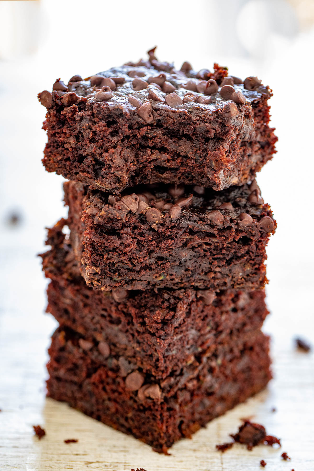 Zucchini Brownies - The BEST zucchini brownies that are EASY, made in one bowl, and no mixer required! Soft, fudgy, and almost taste like rich chocolate cake. They're filled and topped with mini chocolate chips to add even more fabulous chocolate flavor. And NO, you cannot taste the zucchini at all - promise! 