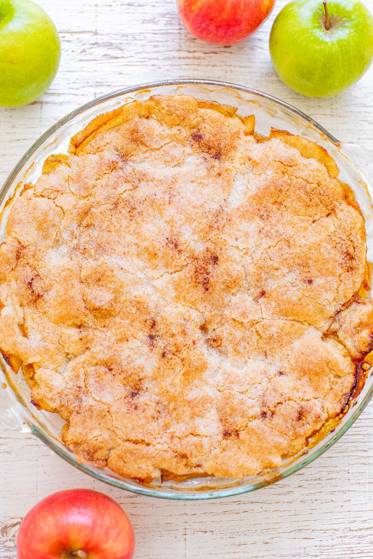 Crustless Apple Pie - Sometimes called Swedish apple pie, this EASY recipe for apple pie without a traditional pie crust is a FAST, foolproof, no-mixer recipe! It's loaded with cinnamon-spiced apples in every bite, dense, chewy, hearty, and is next level when topped with ice cream and salted caramel sauce!