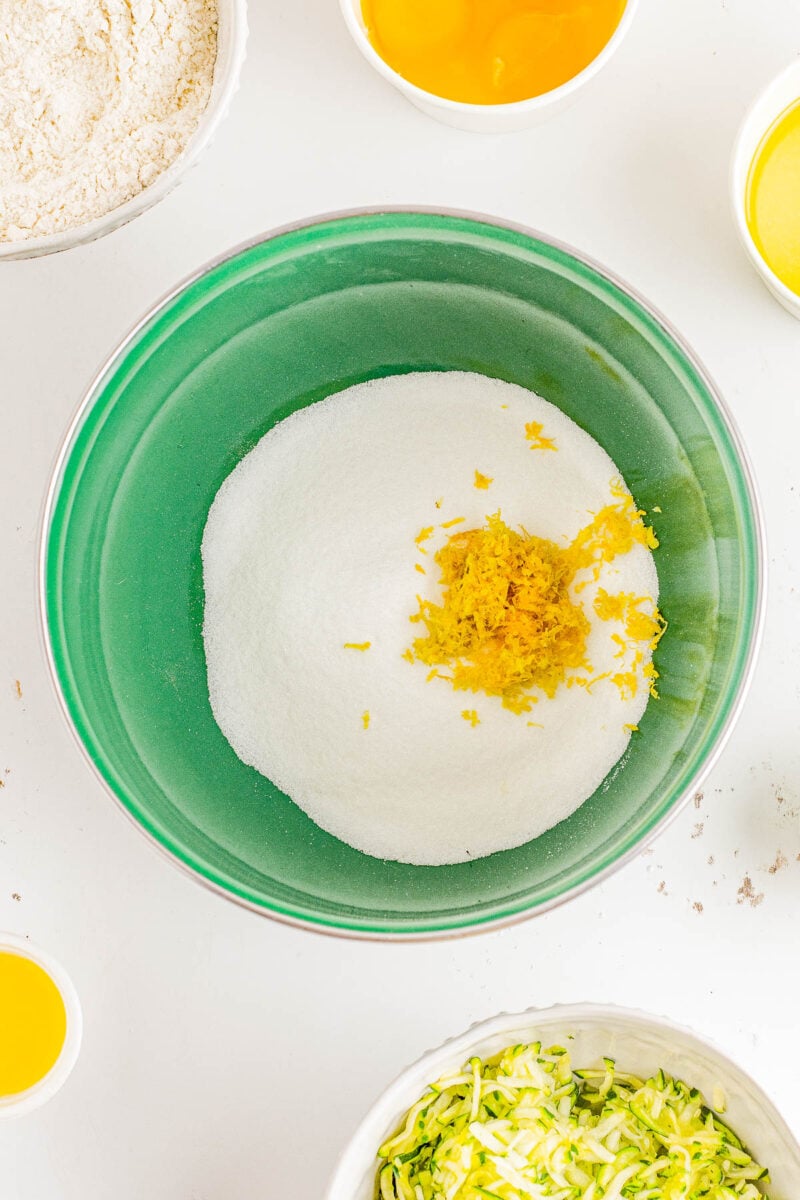 Glazed Lemon Zucchini Bread - This EASY, no-mixer homemade quick bread combines tangy lemon flavor with tender zucchini which keeps it so incredibly soft, tender, and moist! Topped with a simple lemon glaze, this bread is not overly sweet. It's PERFECT for breakfast, brunch, as a snack, or as a lighter summer dessert!