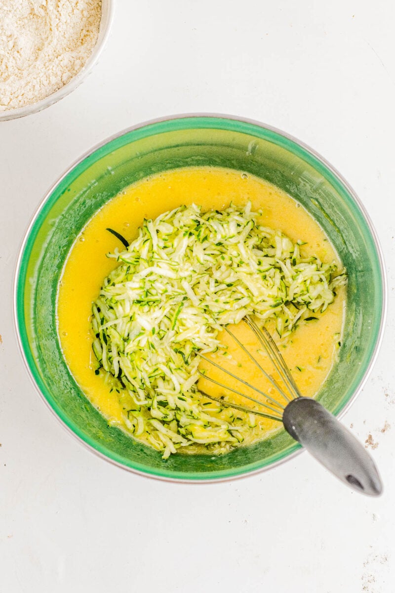 Glazed Lemon Zucchini Bread - This EASY, no-mixer homemade quick bread combines tangy lemon flavor with tender zucchini which keeps it so incredibly soft, tender, and moist! Topped with a simple lemon glaze, this bread is not overly sweet. It's PERFECT for breakfast, brunch, as a snack, or as a lighter summer dessert!