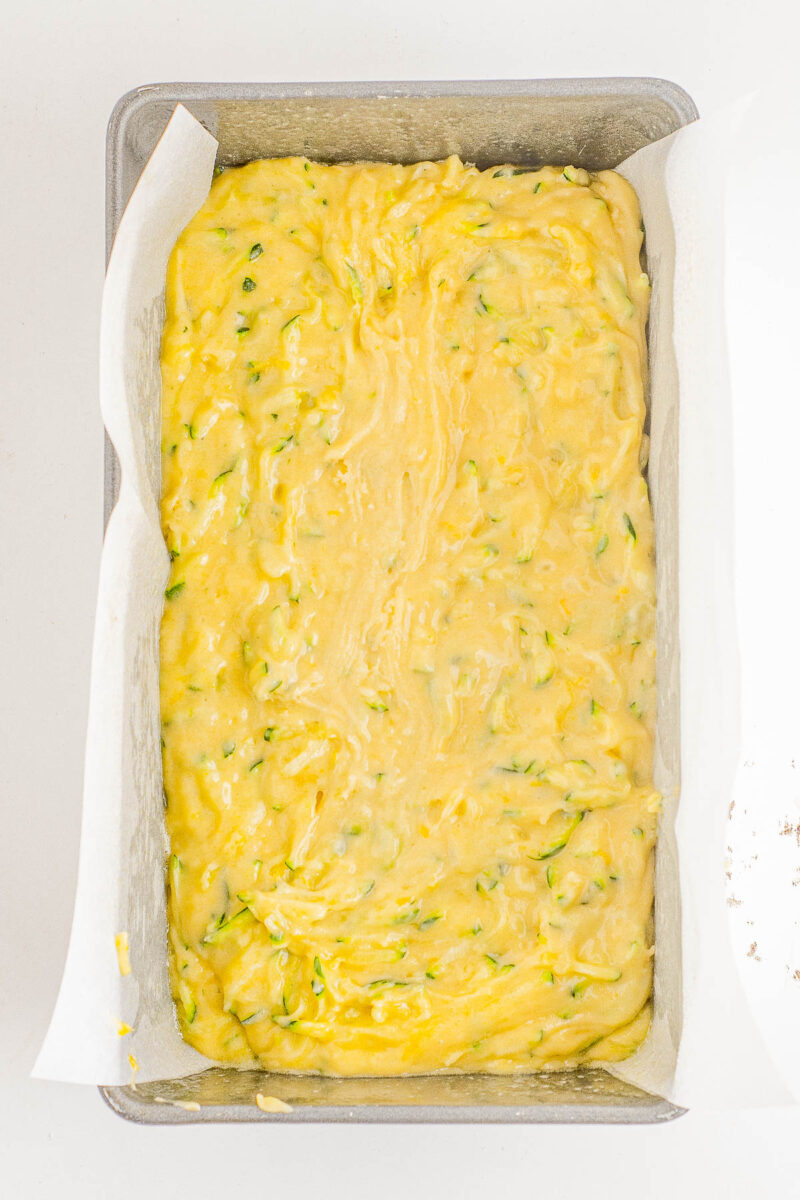 Glazed Lemon Zucchini Bread - This EASY, no-mixer homemade quick bread combines tangy lemon flavor with tender zucchini which keeps it so incredibly soft, tender, and moist! Topped with a simple lemon glaze, this bread is not overly sweet. It's PERFECT for breakfast, brunch, as a snack, or as a lighter summer dessert!