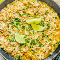 Slow Cooker Green Chile Chicken - Tender, juicy, chicken that's simmered with green chiles, jalapeno, salsa verde, onions, garlic, and spices for the most FLAVORFUL and versatile green chile chicken! Use it in tacos, burritos, casseroles, sandwiches, or as a meal prep recipe. Best of all, it's SO EASY because your slow cooker does ALL the work!