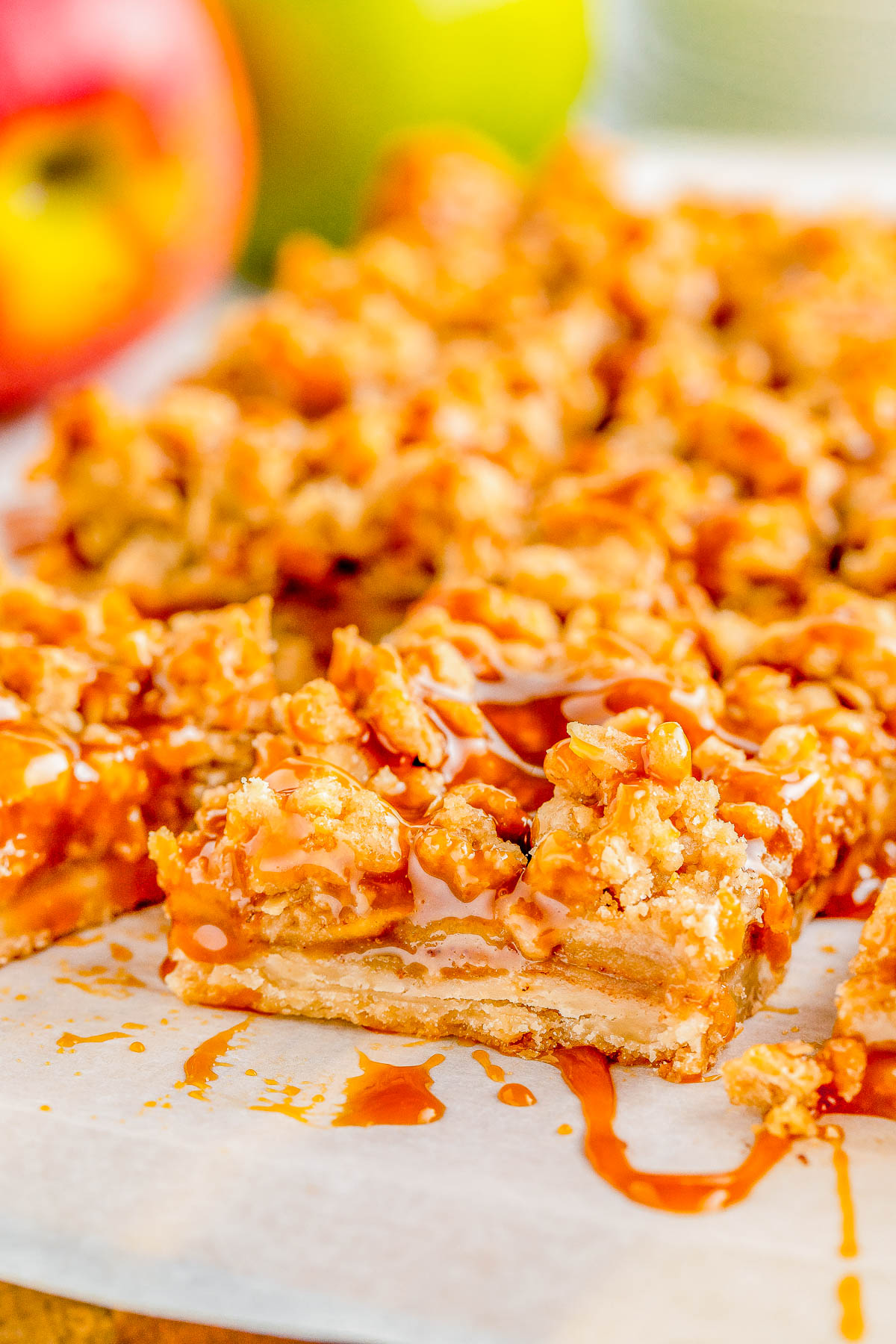 Apple Pie Bars — A flaky, buttery crust is topped with homemade apple pie filling and an oat crumble topping in these INCREDIBLE spiced apple pie bars! Salted caramel sauce is the finishing touch because nothing beats the combination of caramel and apples! Make these EASY, no-mixer bars as written for a smaller gathering, or double it for a party!