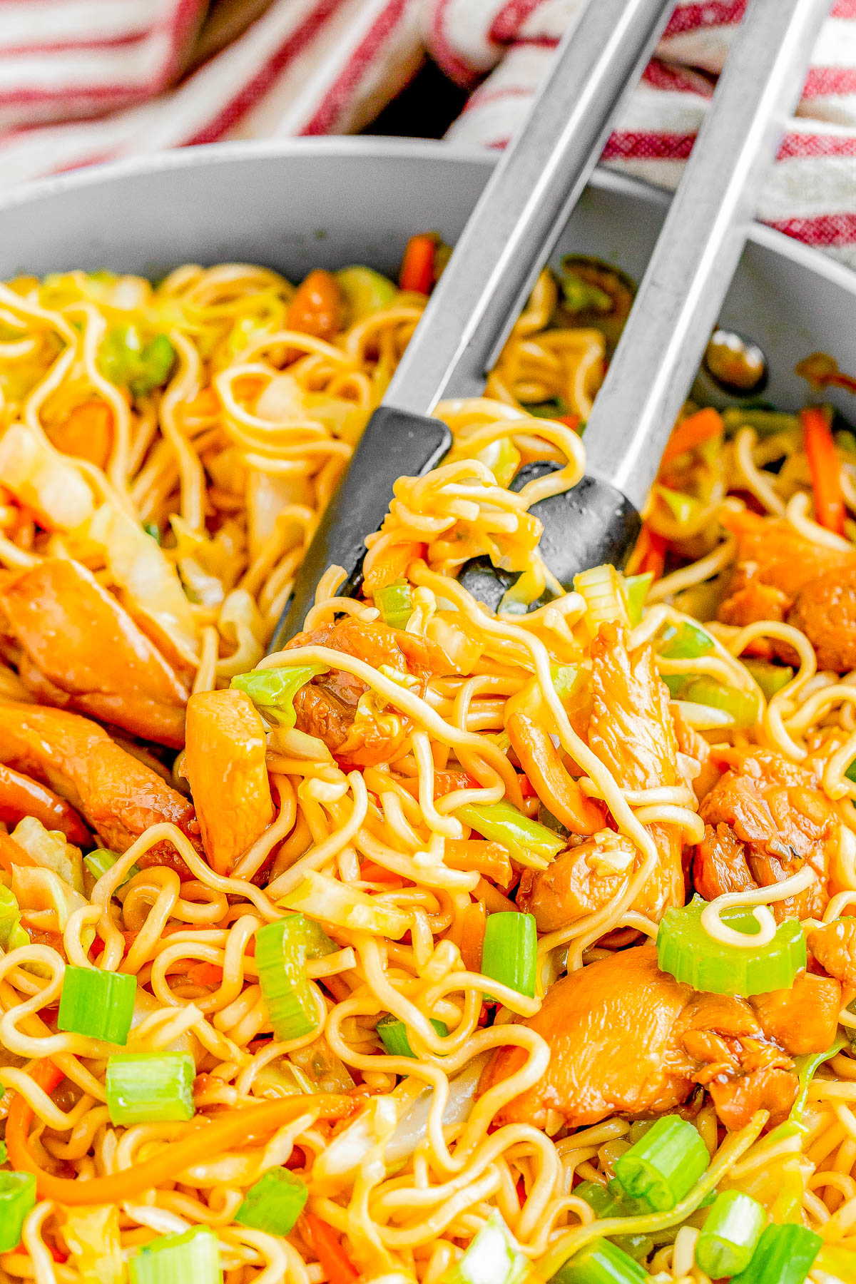 Chicken Chow Mein — Chewy chow mein noodles, crisp-tender veggies, and juicy chicken are stir-fried in a sesame-soy sauce! It’s a SIMPLE and FAST recipe that anyone can make. It's cheaper than ordering take out, your family will be impressed, and you'll love how EASY it is to prepare! 