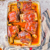 Baked Barbecue Beef Short Ribs - Tender, fall-off-the-bone meat smothered in a homemade BBQ-based sauce that's bursting with sweet, tangy, and smoky flavors! Impress your family and friends with this EASY comfort food recipe that’s perfect for meat lovers and barbecue enthusiasts alike!