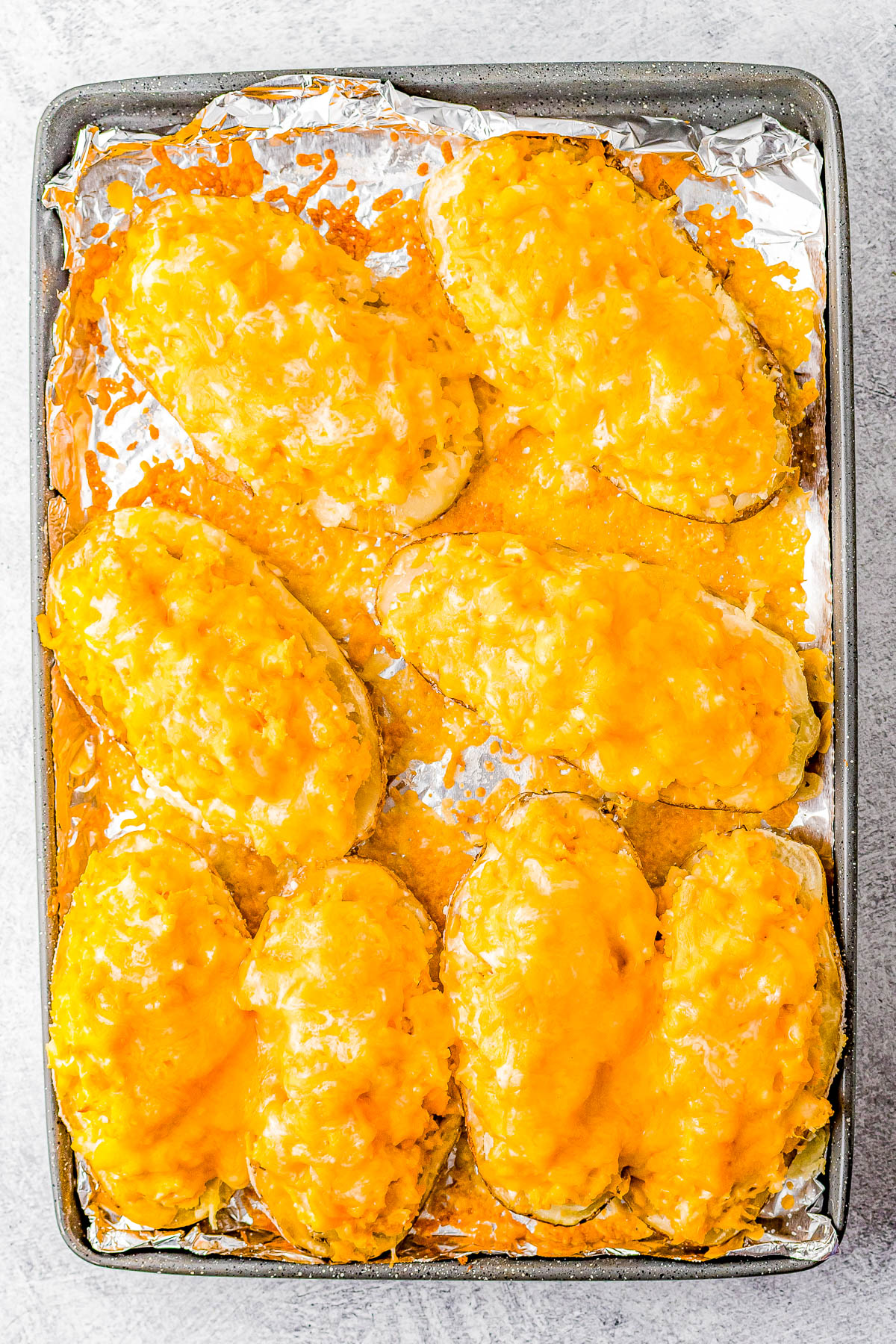 Buffalo Chicken Stuffed Potatoes – If you love the tang and heat of buffalo chicken wings, then you're going to love these EASY stuffed potatoes! Chock full of shredded buffalo chicken, cheddar and mozzarella cheeses, cream cheese, and sour cream, I promise these are a COMFORT FOOD delight! Whether you make them as a main dish for a weeknight dinner, as a party appetizer, or as a game day snack, everyone LOVES them!