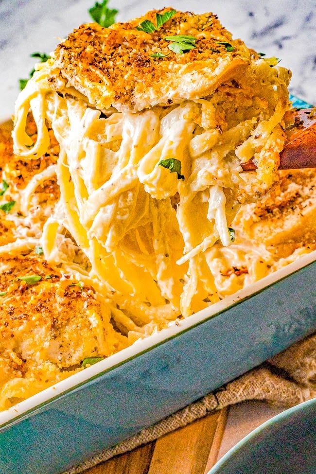 Baked Chicken Fettuccine Alfredo - Italian-inspired, pure. hearty, comfort food! Fettuccine noodles are tossed in a homemade creamy and cheesy alfredo sauce, topped with chicken, baked, and finished off with crispy crunchy breadcrumbs!  A classic yet easy recipe that'll be a guaranteed family favorite!