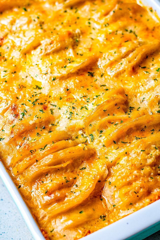 Three Cheese Scalloped Potatoes - These scalloped potatoes are EXTRA cheesy thanks to three cheeses used as well as super rich and CREAMY!! They're a perfect HOLIDAY SIDE DISH as well as family friendly weeknight COMFORT FOOD!