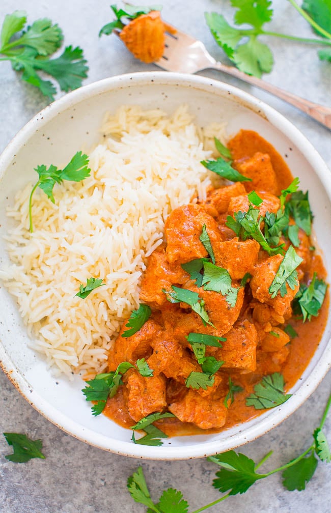 overhead view of instant pot chicken tikka masala and rice in a white dish 