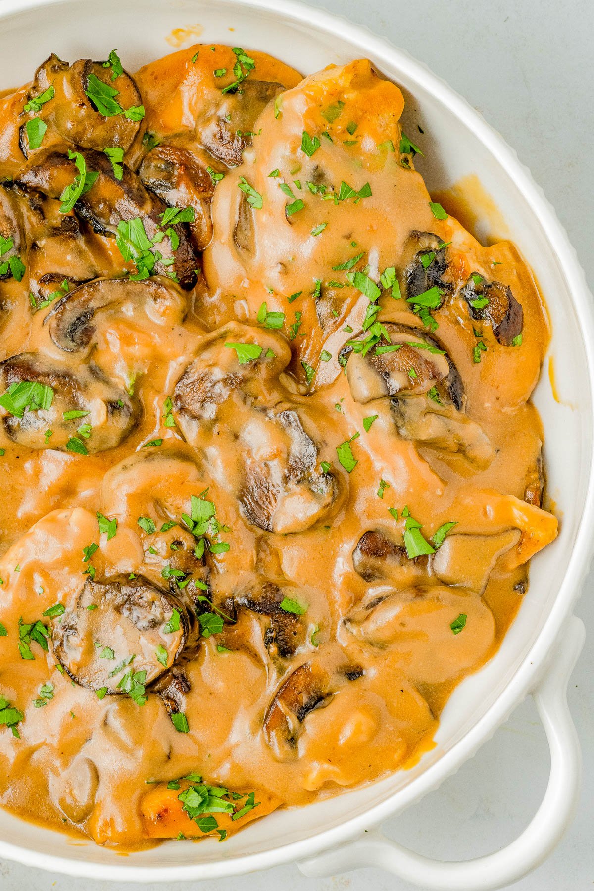 Slow Cooker Chicken Marsala – This classic comfort food recipe is complete with tender chicken breasts that are slow cooked with mushrooms and herbs in a flavorful creamy Marsala wine sauce! The rich sauce makes the perfect gravy served over rice or potatoes. Learn to make this restaurant quality dish at home in your Crock-Pot so that it's EASY enough for weeknight dinners!