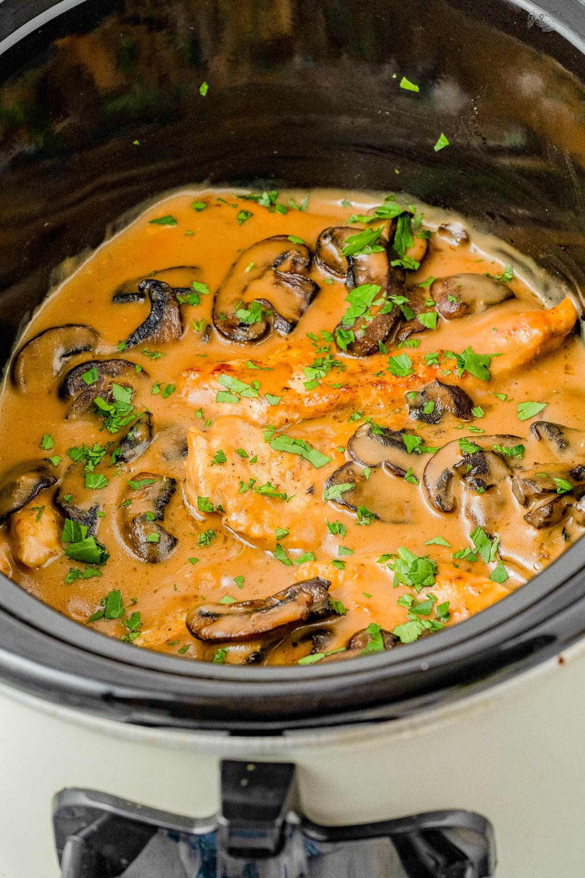 Slow Cooker Chicken Marsala – This classic comfort food recipe is complete with tender chicken breasts that are slow cooked with mushrooms and herbs in a flavorful creamy Marsala wine sauce! The rich sauce makes the perfect gravy served over rice or potatoes. Learn to make this restaurant quality dish at home in your Crock-Pot so that it's EASY enough for weeknight dinners!