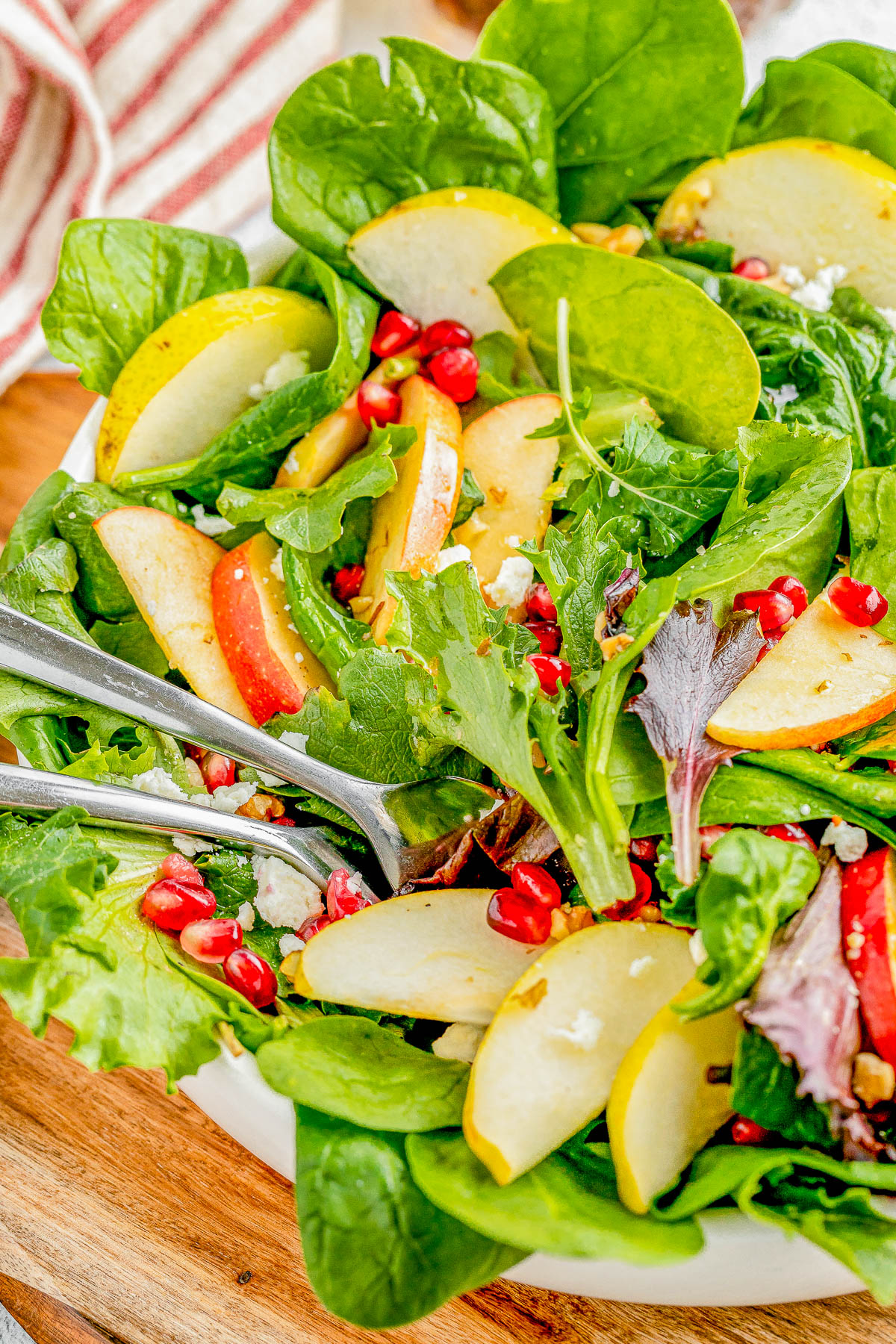 Apple and Pear Salad with Balsamic Vinaigrette - Complete with crisp apples, tender juicy pears, pomegranate seeds, nuts, crumbled feta, and a tangy homemade honey maple balsamic vinaigrette! Whether you're looking for a quick lunch idea, dinner side, or a holiday side dish for Thanksgiving or Christmas, this FAST and EASY salad is sure to get rave reviews!