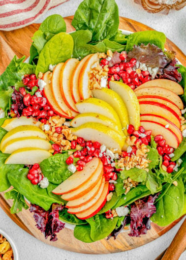 Apple and Pear Salad with Balsamic Vinaigrette - Complete with crisp apples, tender juicy pears, pomegranate seeds, nuts, crumbled feta, and a tangy homemade honey maple balsamic vinaigrette! Whether you're looking for a quick lunch idea, dinner side, or a holiday side dish for Thanksgiving or Christmas, this FAST and EASY salad is sure to get rave reviews!