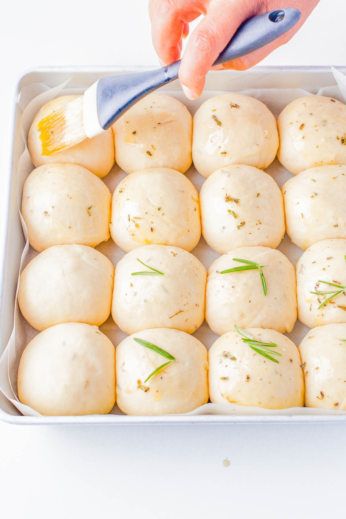 Garlic Herb Rolls - Indulge in the perfect holiday side dish with a basket of homemade garlic and herb rolls! Made wit