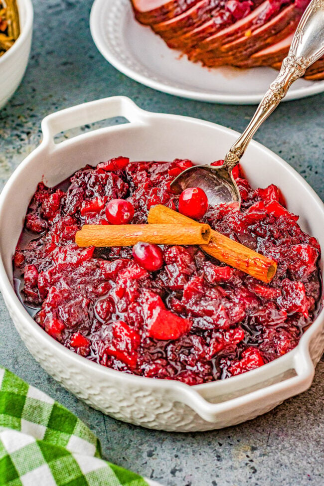 Cinnamon Apple Cranberry Sauce - Spice up your holiday celebrations with this scrumptious FAST and EASY homemade cranberry sauce that's made with cranberries, apples, apple cider, cinnamon sticks, and allspice for the PERFECT must-make side dish! A lovely balance of sweet-yet-tart with warmly spiced flavors so you'll never want to think about using store bought sauce again! 