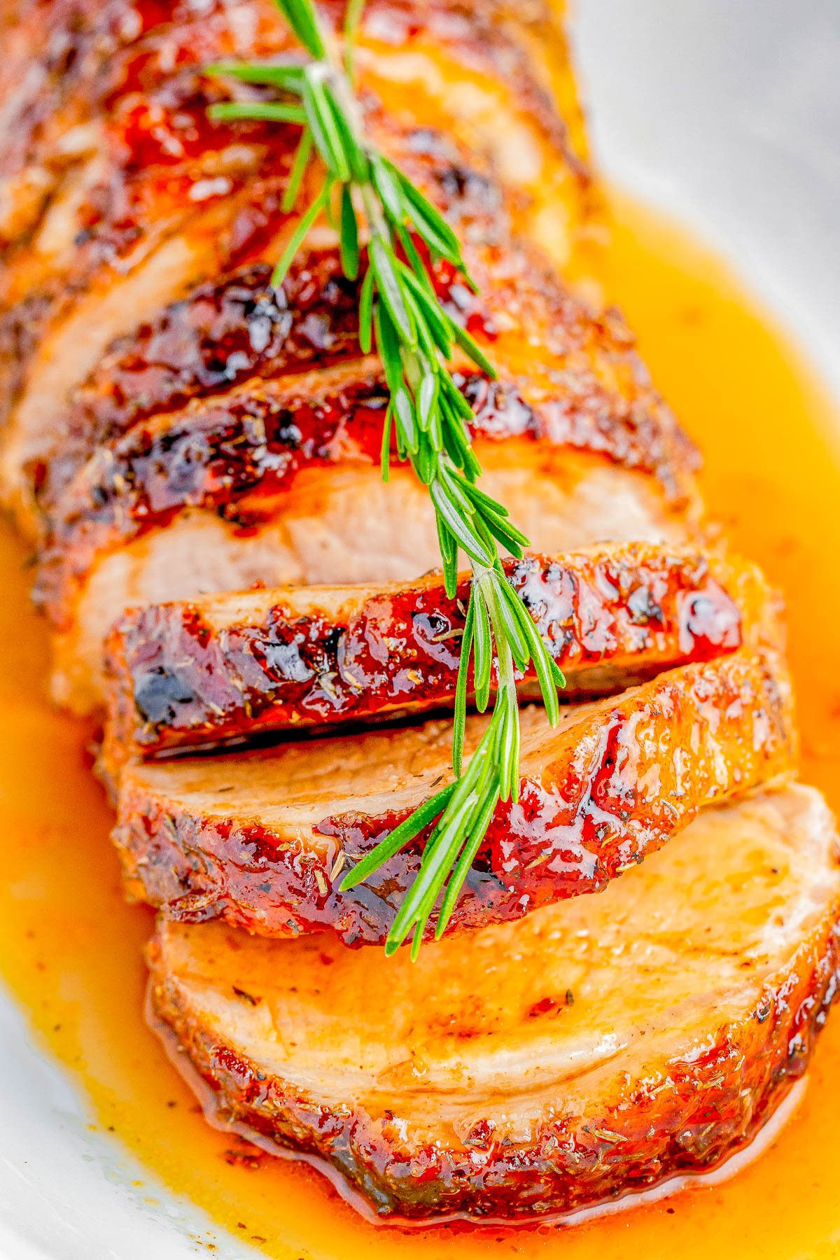 Glazed Pork Loin Roast — Pork loin is first coated in a FLAVOR-PACKED dry spice rub, then topped with a tangy brown sugar glaze before being roasted. EASY enough to make on busy weeknights, but IMPRESSIVE enough to serve to guests or make for the holidays! 