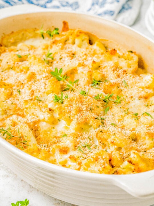 Cheesy Cauliflower Gratin — Cauliflower florets are coated in a creamy cheese sauce and sprinkled with a crispy panko breadcrumb topping before being baked to golden, bubbly perfection! This is an EASY yet ELEGANT side dish that’s perfect for busy weeknights and holiday meals alike including Thanksgiving, Christmas, or New Year's Eve!