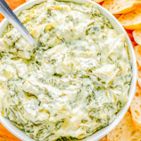Crockpot Spinach Artichoke Dip in a bowl.