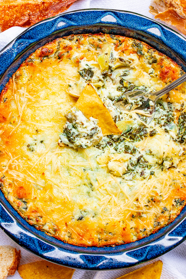 Best Spinach Artichoke Dip - This baked spinach and artichoke dip is rich, creamy, and it's a crowd FAVORITE sure to disappear at parties!! It's so cheesy thanks to both mozzarella and Parmesan cheeses! It's just THE BEST!!