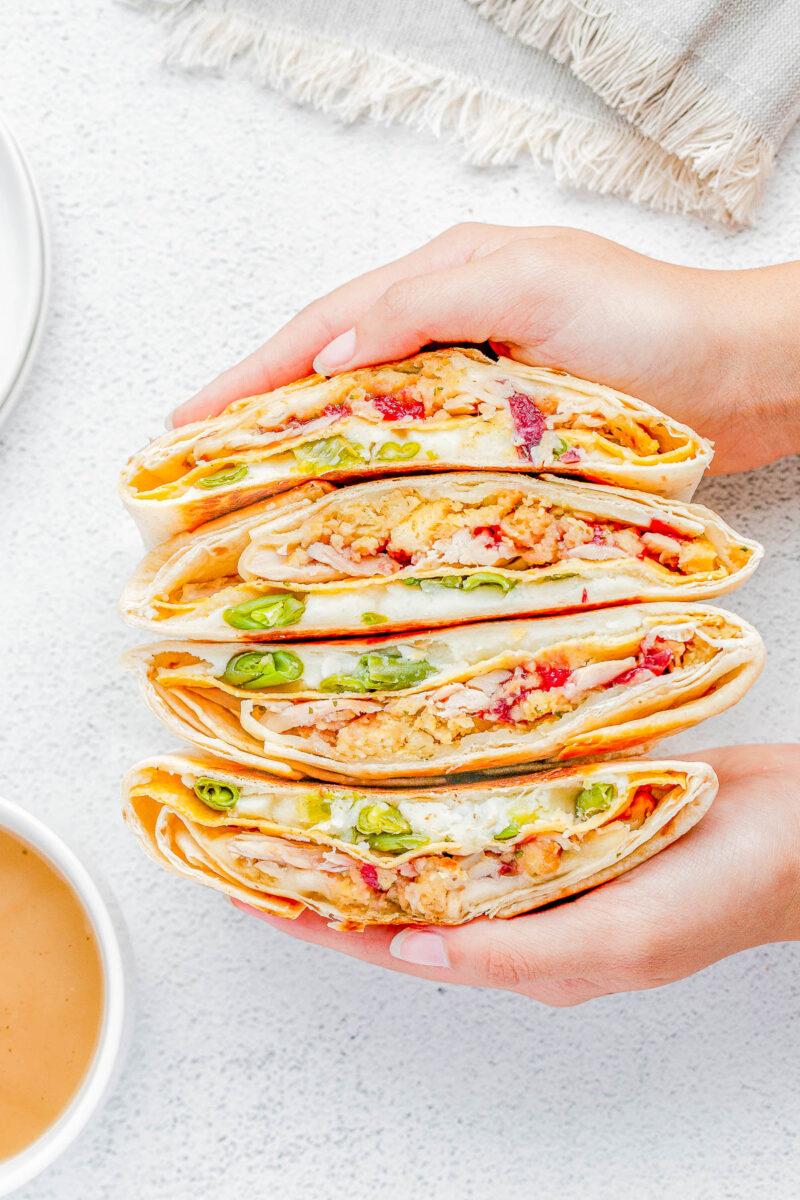 Thanksgiving Crunchwrap Supreme โ Not sure what to do with all of those Thanksgiving leftovers? Turn them into Thanksgiving Crunchwraps! A soft flour tortilla and crunchy corn tostada base is piled high with your favorite Thanksgiving leftovers including turkey, mashed potatoes, stuffing, and more before sealing them, toasting, and dunking them in gravy. Leftovers never tasted so good!