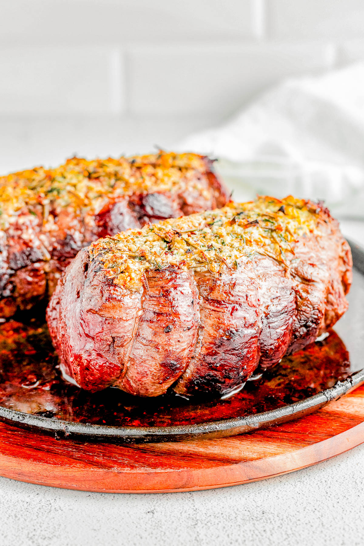 Easy Beef Tenderloin Roast with Garlic Herb Butter — An EASY yet IMPRESSIVE dish that’s ready in under an hour! Roasting beef tenderloin in the oven results in perfectly MOIST and TENDER meat every time, and the garlic herb butter adds tons of flavor without overwhelming the beef. If cooking beef tenderloin intimidates you, follow this straightforward recipe!   